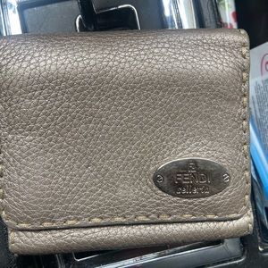 Small Fendi trifold gray wallet.